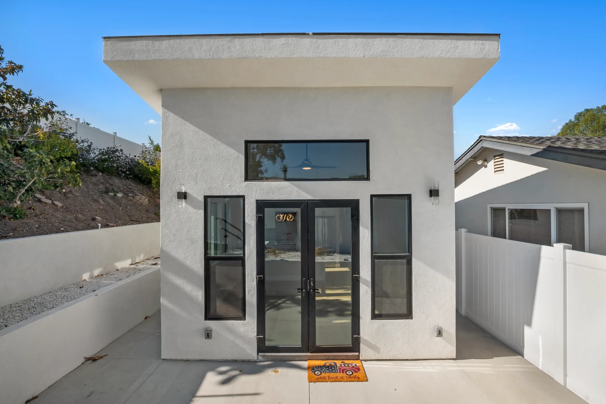 Modern detached ADU exterior with French doors