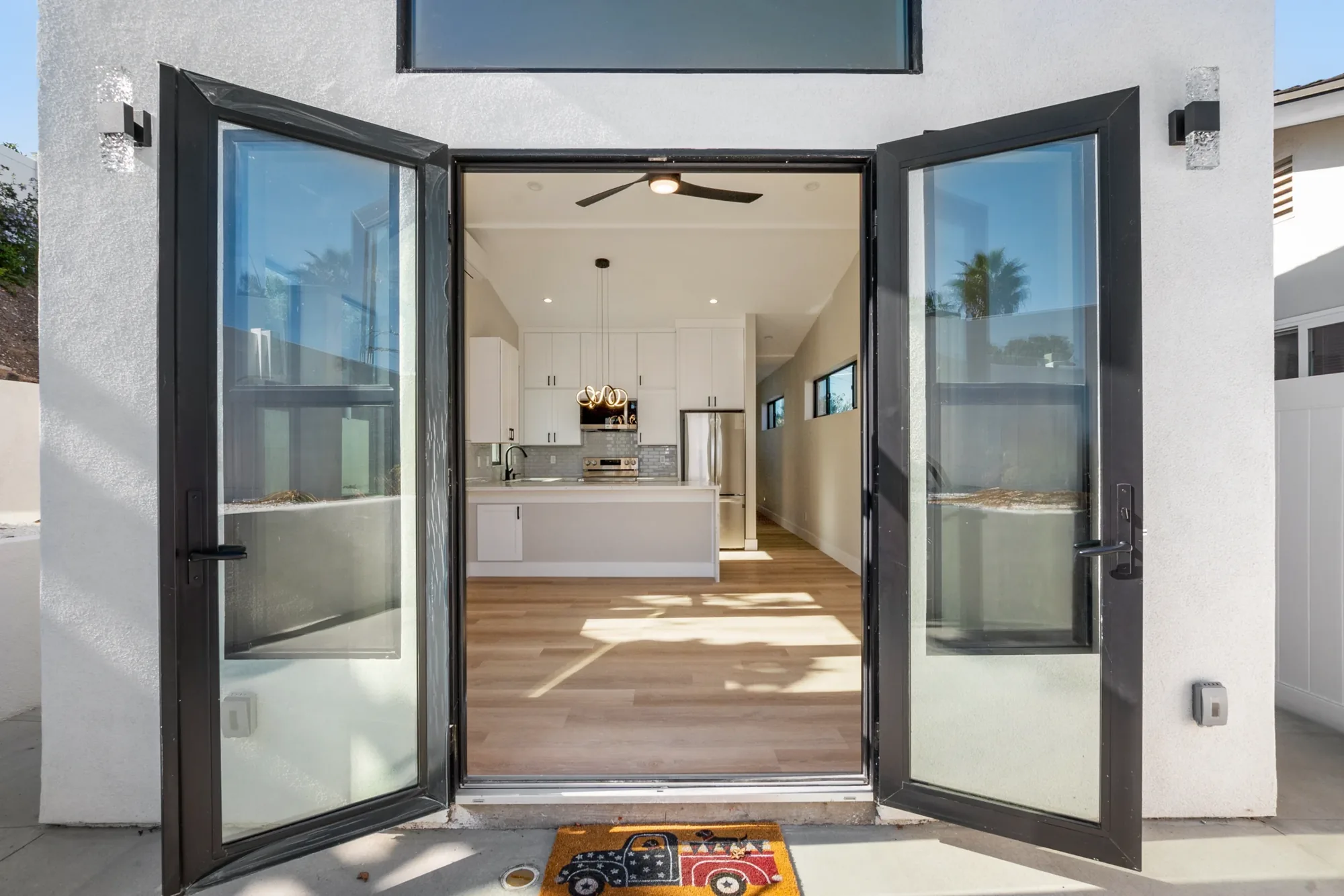 ADU private entry with French doors open to the interior