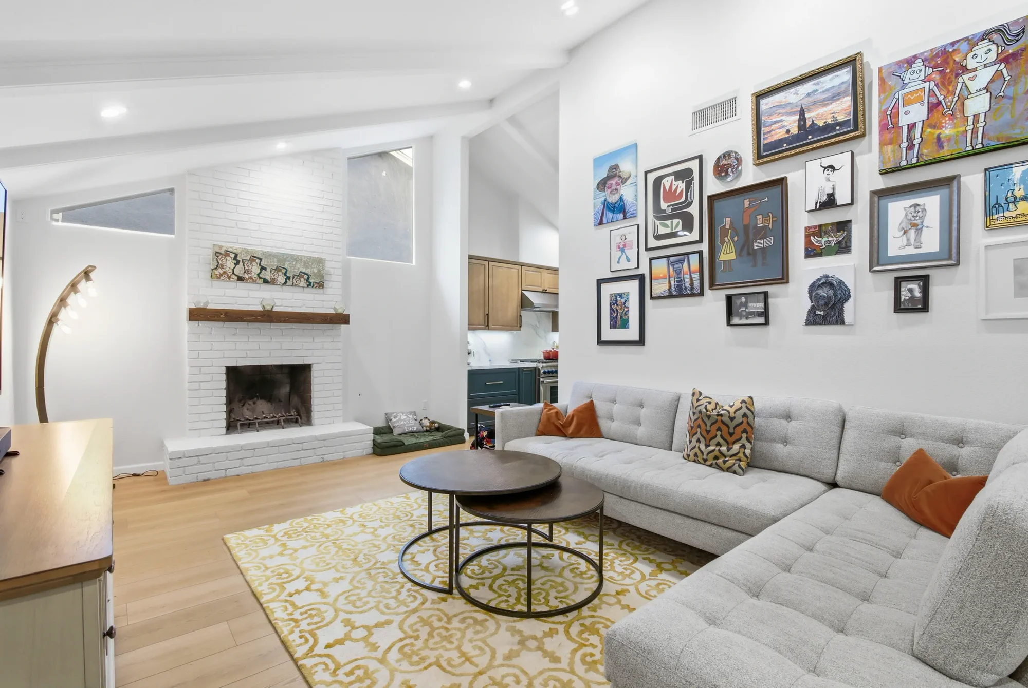 Remodeled open living space with gallery wall