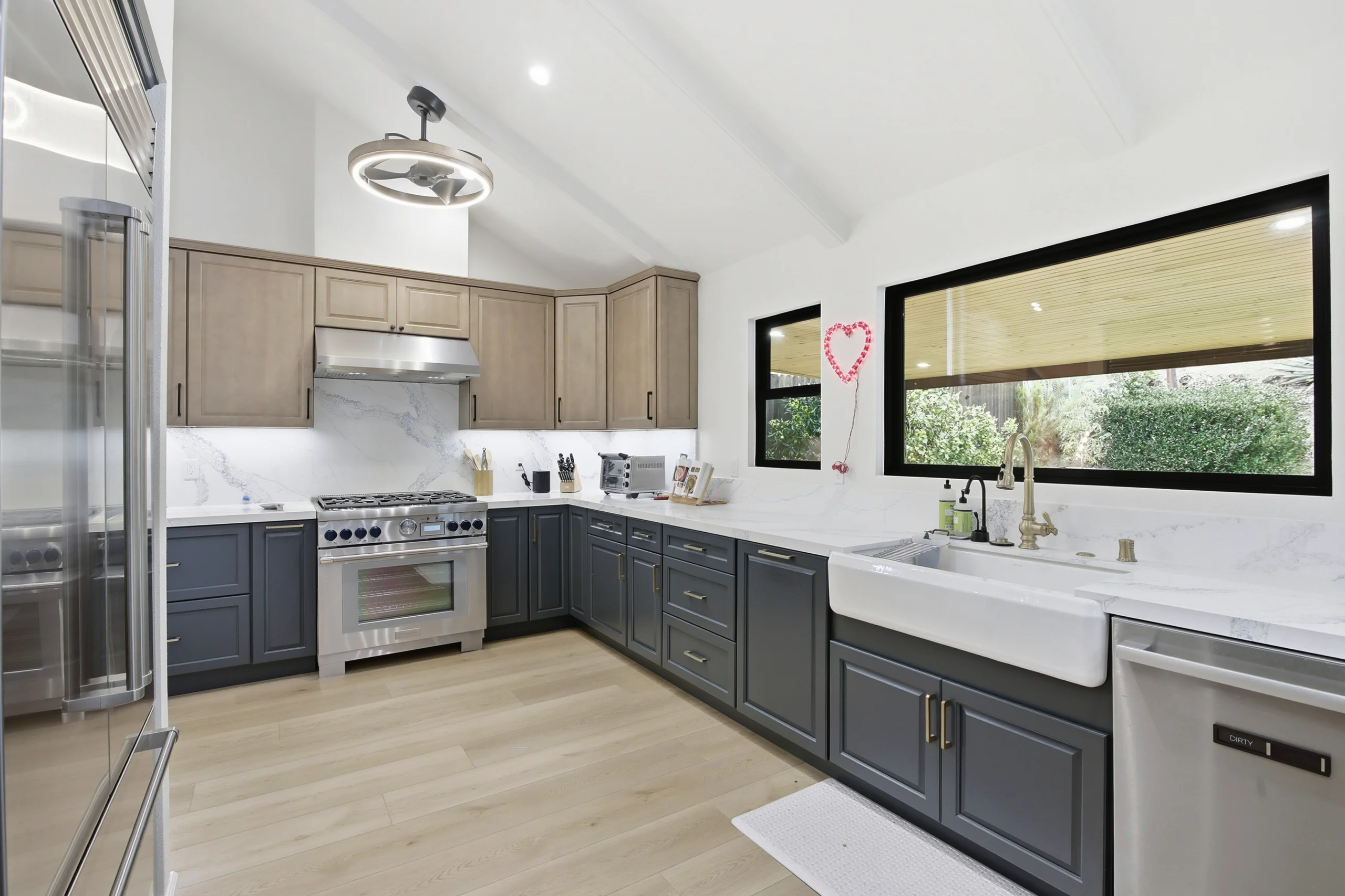 Kitchen remodel with quartz countertops and farmhouse sink in San Diego by Elements Design & Build